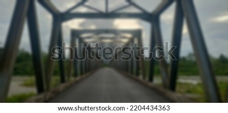 defocused photo background blur of rusty old iron bridge