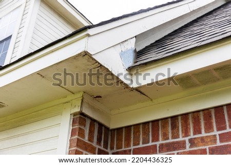 Rotten wood on Soffit and Fascia boards of house Royalty-Free Stock Photo #2204436325