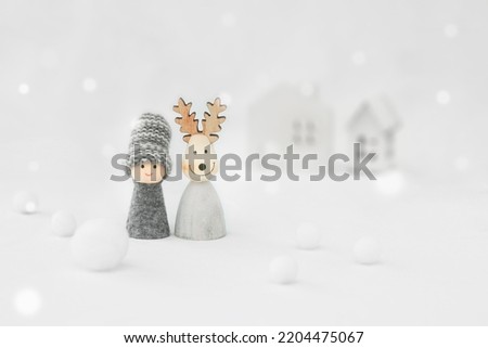 Two people living in a cold region. An image of a couple and friends cuddling in a snowy landscape.