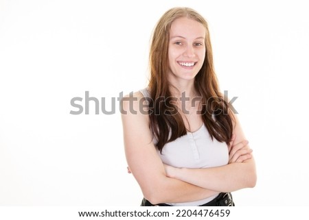 pretty businesswoman smiling woman standing in the office arms crossed isolated over white background