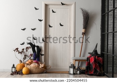 Wooden door with paper bats in hall decorated for Halloween