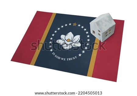 Small house on the new flag of Mississippi, living the the state of Mississippi