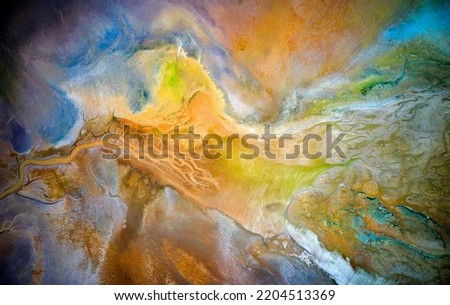 Dry lake or swamp in the process of drought and lack of rain or moisture, a global natural disaster - aerial drone view Royalty-Free Stock Photo #2204513369