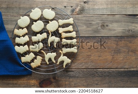 Baked cookies for Halloween. Cookies in different shapes. Copy space. Top view.