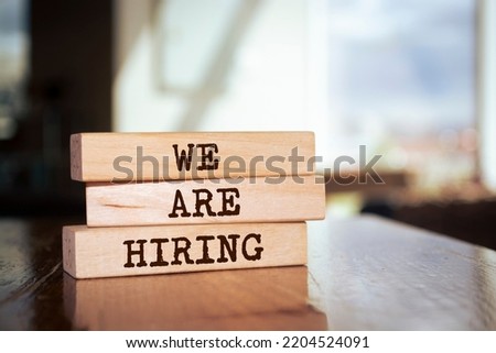 Wooden blocks with words 'we're hiring'. Royalty-Free Stock Photo #2204524091