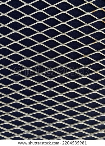 iron grid on blue cloth