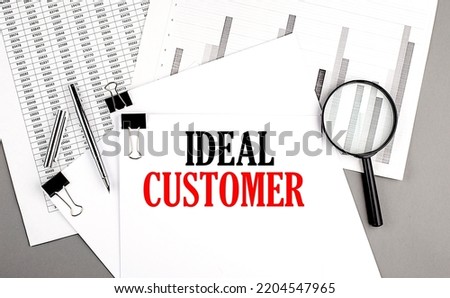 IDEAL CUSTOMER text on a paper on chart background