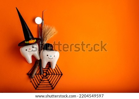 Happy halloween.dental concept.spider web pumpkin.dental tools on orange