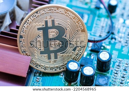 Crypto currency or Bitcoin Crypto on mainboard computer. Concept of financial currency digital or investment of exchange wealth in cryptocurrency teachnology