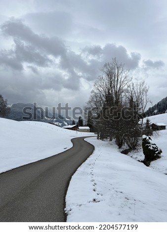 asphalt trail on a snowy mountain