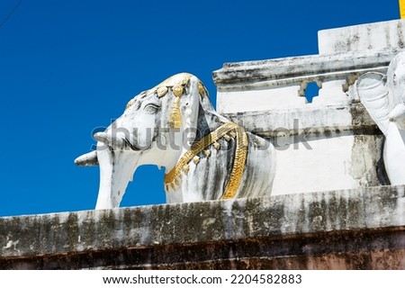 Wat Phra That Chang Kham pagoda appears to be supported by 24 elephant statues protruding out of its base.