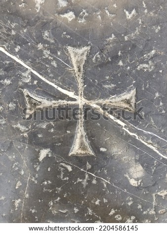 historical marvelous christian cross sign engraved on gray marble