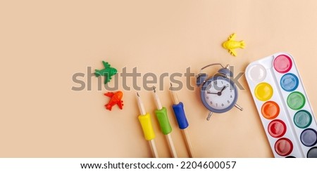 Top view of stationery on pastel background,large banner with copy space.