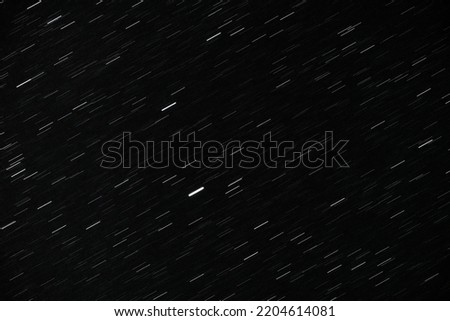Beautiful shining stars in the night sky background. Long exposure