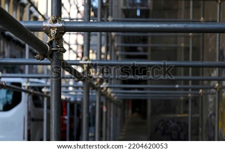 Construction to hold the scaffolding on a building in Naples, Italy