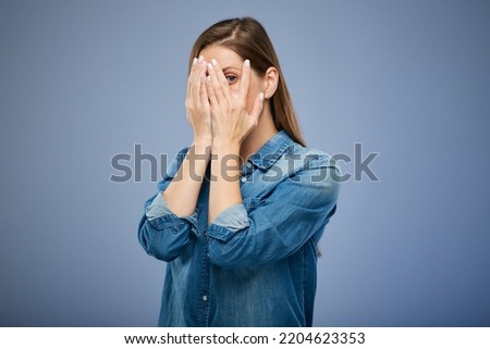 Woman hide her face with hands. isolated female portrait. Royalty-Free Stock Photo #2204623353