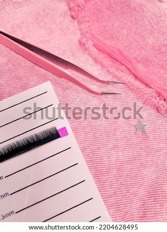 Mink lashes for eyelash extensions on pink background,beauty equipment . High quality photo