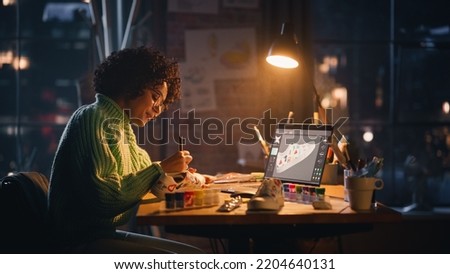 Creating Trendy Design. Black Woman Feels Inspired While Drawing in the Evening. Female Designer Puts Patterns on Shoe Comparing with 3D Model on the Laptop Computer Screen.