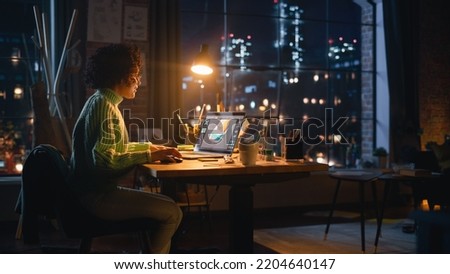 Hispanic Female Designer Changes Colour of 3d Model of the Shoe, Creating Footwear Design on her Laptop Computer During the Evening. Girl Working Remotely. Graphic Designer Concept.