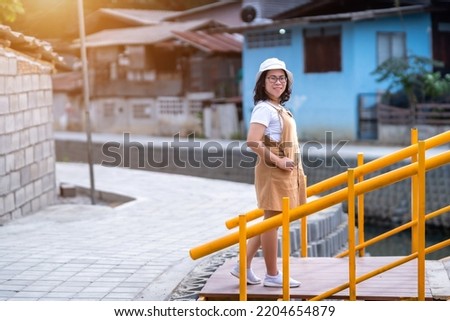 Portrait asian woman tourist Traveler walking and with travel at Mae Kha canal New Landmark It is a major tourist is Public places attraction Chiang Mai City,Thailand,travel and leisure concept day