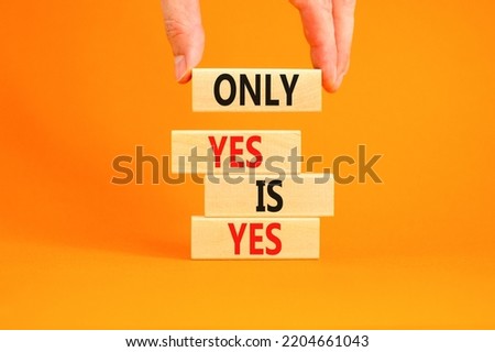 Only yes is yep symbol. Concept words Only yes is yes on wooden blocks on a beautiful orange table orange background. Businessman hand. Business, psychological only yes is yep concept.