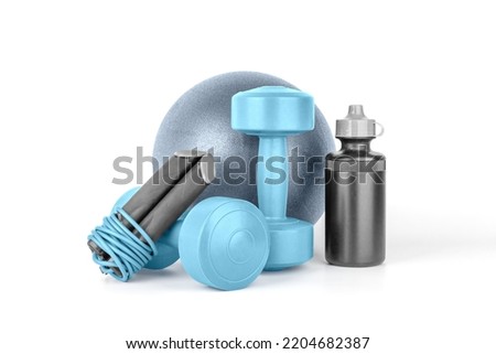 Set of fitness equipment. Dumbbells, sport bottle of water, jump rope, gymnastic ball on a white background isolated, front view, close-up. Home workout. Fitness and activity. Royalty-Free Stock Photo #2204682387