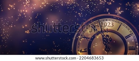 happy new year 2023 countdown clock on abstract glittering midnight sky with copy space, party invitation card concept for new years eve Royalty-Free Stock Photo #2204683653