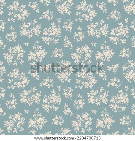 Beautiful floral pattern in small abstract flowers. Small white flowers. Light blue background. Ditsy print. Floral seamless background. The elegant the template for fashion prints. Stock pattern. Royalty-Free Stock Photo #2204700715