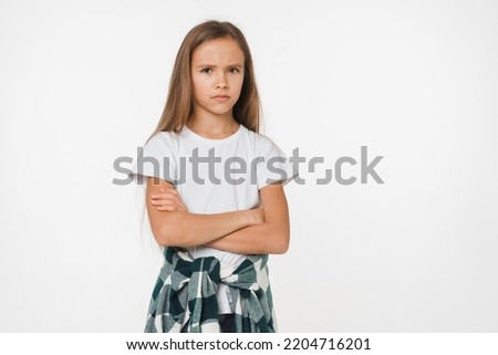 Offended sad angry caucasian preteen teenage girl schoolgirl showing negative emotions feeling frustrated isolated in white background Royalty-Free Stock Photo #2204716201