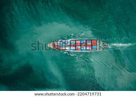 container ship to import export marine goods to dealers and consumers across the pacific and around the world, businesses and industries Ocean freight forwarding, aerial top view