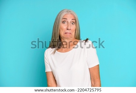 gray hair senior pretty woman holding an insect with her fingers