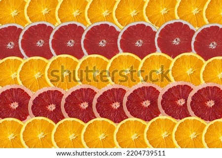 Sliced green grapefruits or red Oranges  and sweet oranges background for wallpaper. Fruits background usage. Flat Lay.