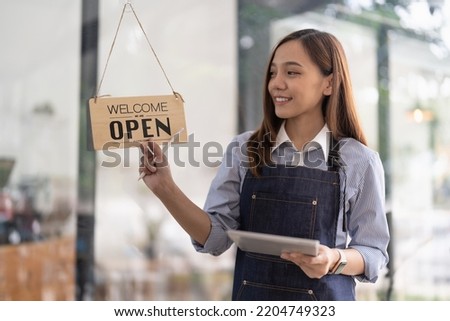 Welcome open shop barista waitress open sign on glass door modern coffee shop ready to serve restaurant cafe retail small business owners.
