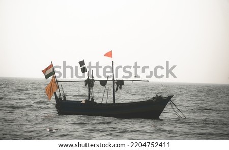 A boat on the ake with a flag