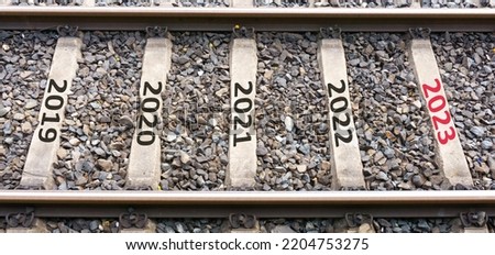 Happy New Year 2023 anniversary concept. Transition from 2022 to new year 2023 concept with the texts on rail. High resolution photo for large displays, print, banners.