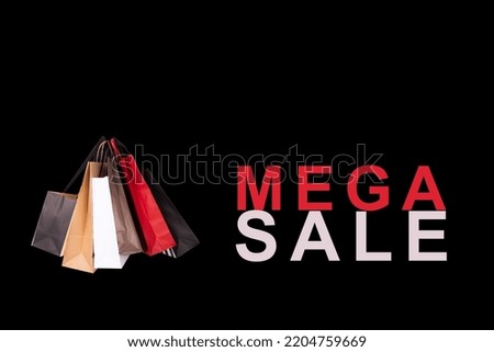 Mega Sale banner with shopping bags on a black background