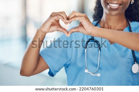 Heart hand and black woman nurse in hospital with expression to show love and care for career. Professional medical facility worker in uniform with happy smile and self love sign at work.