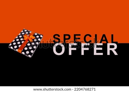 Special Offer banner. Gift box with an orange ribbon on a black and orange background