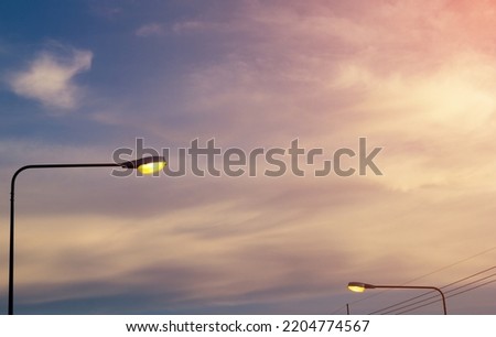 Street lights in twilight time across sky and clouds, Minimal style concept,Sun