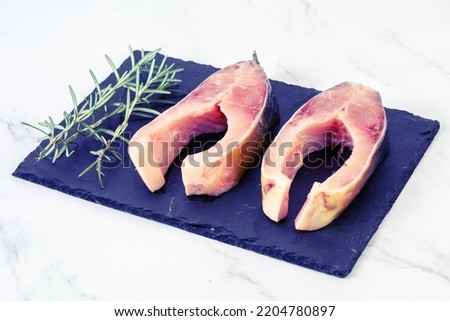 Carp Fish slices with Rosemary branches