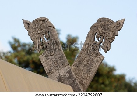 viking tent with wooden dragon heads	 Royalty-Free Stock Photo #2204792807