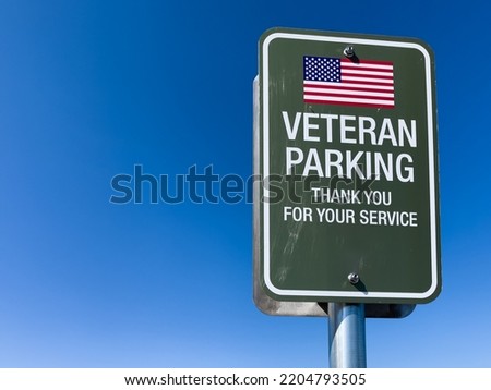 Veteran parking sign to honor and thank United States military service members.