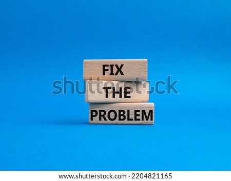 Fix the problem symbol. Wooden blocks with words Fix the problem. Beautiful blue background. Business and Fix the problem concept. Copy space.