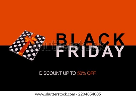 Black Friday banner. Gift box with an orange ribbon on a black and orange background 