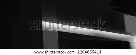 Architectural detail. Polygonal structure of metal girder. Black and white geometric background with copyspace. Ceiling and roof constructions. Fragment of abstract modern architecture. 