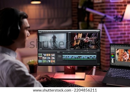 Content creator editing video footage on computer software, using color grading and visual effects to create film montage. Working on movie edit for multimedia production at home. Royalty-Free Stock Photo #2204856211