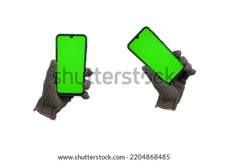 some poses of gloves holding a green screen cellphone.  isolated white background