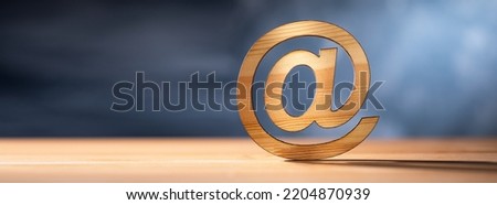 Wooden email symbol on the table
