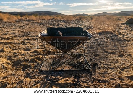portable camp fire pit in the middle of nowhere empty desert overlanding camping