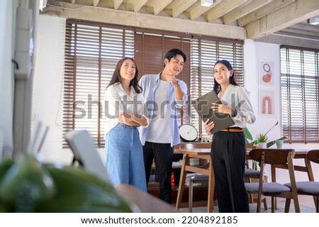 A Female real estate agent explaining about the house option and offering promotions to young married couple, Mortgage, loan, property and insurance concept. 
